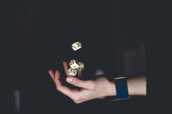 person-about-to-catch-four-dices-1111597-1024×683